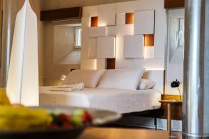 Letto o letti in una camera di SampieriSuite