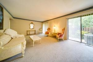 a bedroom with a bed and a large window at Elegant Cleveland Area Retreat 4 Mi to Lake Erie! in Richmond Heights