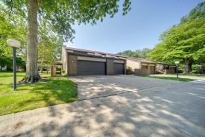 a driveway in front of a house with a garage at Elegant Cleveland Area Retreat 4 Mi to Lake Erie! in Richmond Heights