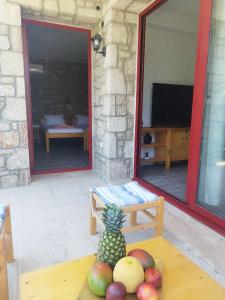 a room with a table with a pineapple on it at Tropical Garden Prime Accommodation in Faliraki