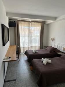 TV a/nebo společenská místnost v ubytování L'Illa Hotel + 31 fotografií