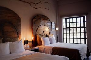 Postel nebo postele na pokoji v ubytování Hotel Rocaval San Cristóbal de las Casas