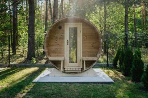a circular sauna in the middle of a forest at Domek z basenem nad Bugiem in Błonie +40 photos
