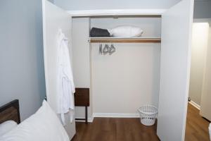 a room with a closet with a bed in it at Luxury 3BR Townhome in the Heart of Winston Salem NC - Sleep 6 in Winston-Salem