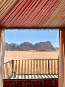 a window with a view of the desert and mountains at Desert's Soul Wadi Rum in Disah