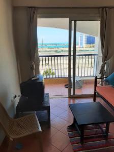 A balcony or terrace at Porto Residence Chalet, Outside Marina Gate 3, Sahel North Coast For Rent - شاليه بورتورسيدنس بخارج بوابة 3 مارينا الساحل الإيجار