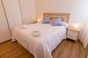 Postel nebo postele na pokoji v ubytování Maile Apartamentos