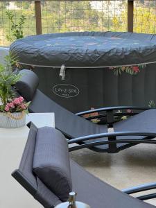 a trampoline with a bed on top of a table at Domaine luna estella in Tourrette-Levens