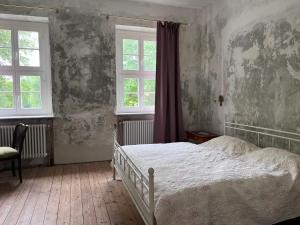 Postel nebo postele na pokoji v ubytování Gut Manderow an der Ostsee