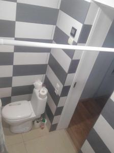 a bathroom with a white toilet in a room at Bluci seksti in Seksti +52 photos