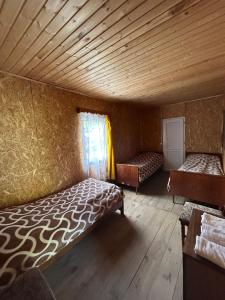 Voodi või voodid majutusasutuse Shio's Stonehouse in Tusheti toas