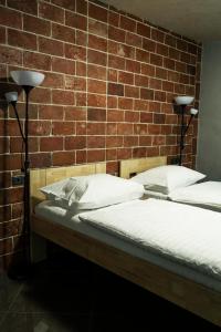 Voodi või voodid majutusasutuse Hotel JURKOS toas