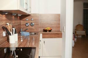 a kitchen with a sink and a counter top at ☆Luxuriöses Apartment☆ Central MUC Enjoy & relax in Munich
