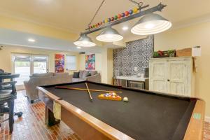 a pool table in a living room with at Rocky Vines Wine Country Retreat with Mountain Views in Leesburg