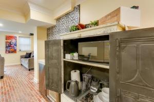 a kitchen with an open cabinet with a microwave at Rocky Vines Wine Country Retreat with Mountain Views in Leesburg