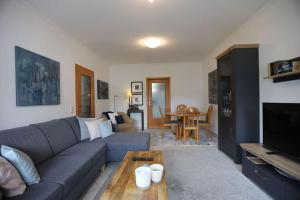 a living room with a couch and a table at Property in Daun in Daun