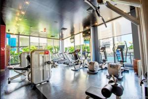 a gym with a bunch of treadmills and machines at Studio in Hallandale 2B/1B amazing views in Hallandale Beach