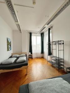 a bedroom with two beds in a room at Nice View Rooms In Old Town in Kraków