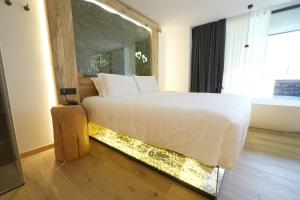 Giường trong phòng chung tại Hotel Chalet Al Foss