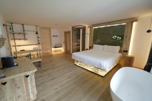 Giường trong phòng chung tại Hotel Chalet Al Foss