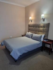 Katil atau katil-katil dalam bilik di Gariep Country Lodge