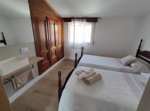 A bed or beds in a room at A casa de Mateu