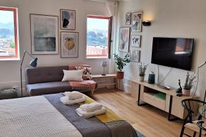 a living room with a bed and a couch at Fontainhas Hidden Gem in Porto