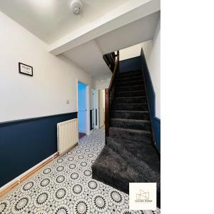 a staircase in a room with a stair case at Monthly Offers, 7 Guests, Business, WIFI in Wyken