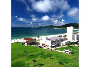 a building on the beach next to the ocean at EN Resort Kumejima EEF Beach Hotel - Vacation STAY 59139v in Kumejima