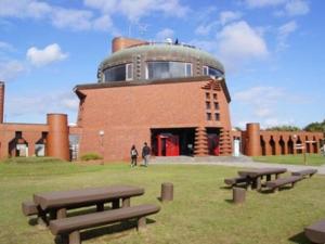 a group of picnic tables in front of a building at Hotel Axia Inn Kushiro - Vacation STAY 67227v in Irifunechō