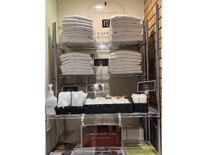 a room filled with white towels on a shelf at Hotel Axia Inn Kushiro - Vacation STAY 67217v in Irifunechō