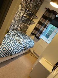 a bedroom with a bed and a window at The Sowerby's in Robert Town