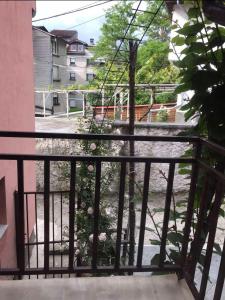 a balcony with a fence and a courtyard at Apartman u Kuci u Konjicu in Konjic