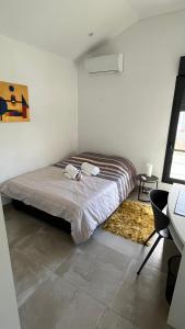 Postel nebo postele na pokoji v ubytování Villa HIMANI + 12 fotografií