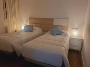 Postel nebo postele na pokoji v ubytování Maile Apartamentos