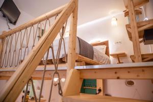 a room with a loft bed and a staircase at Mythical Luxury Apartment in Naxos Chora