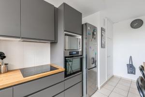 Kuchyň nebo kuchyňský kout v ubytování Appartement Chirpaz - Welkeys
