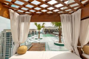 a view of a pool from a hotel room at Hôtel Swexan in Dallas