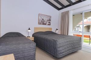 Postel nebo postele na pokoji v ubytování Aztec Motel + 33 fotografií