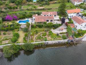 an aerial view of a house on the water at Casa do Pombal in Medas