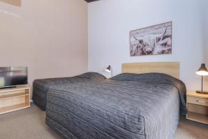 Postel nebo postele na pokoji v ubytování Aztec Motel