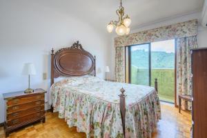 Ένα ή περισσότερα κρεβάτια σε δωμάτιο στο Casa do Pombal