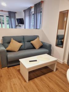 TV a/nebo společenská místnost v ubytování Maile Apartamentos