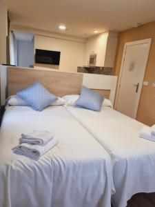 Postel nebo postele na pokoji v ubytování Maile Apartamentos