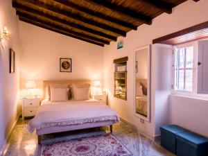 a bedroom with a bed and a window at Finca Los Ángeles in Trapiche +89 photos