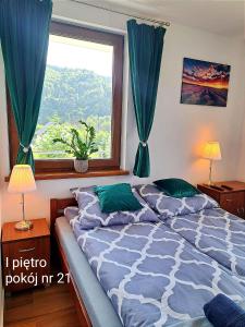 Ένα ή περισσότερα κρεβάτια σε δωμάτιο στο Dom Gościnny Horyzont nad Popradem