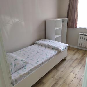 Postel nebo postele na pokoji v ubytování LEO