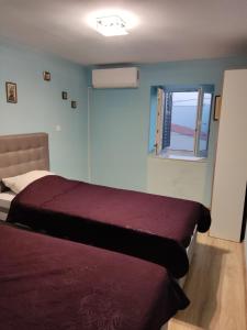 Postel nebo postele na pokoji v ubytování apartman Zdravko + 12 fotografií