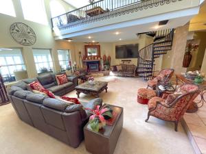 a large living room with couches and chairs at The Inn at 37 Main in Rockville