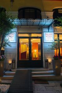 a front door of a building at night at Delphi Art Hotel by Prima Hotels in Athens